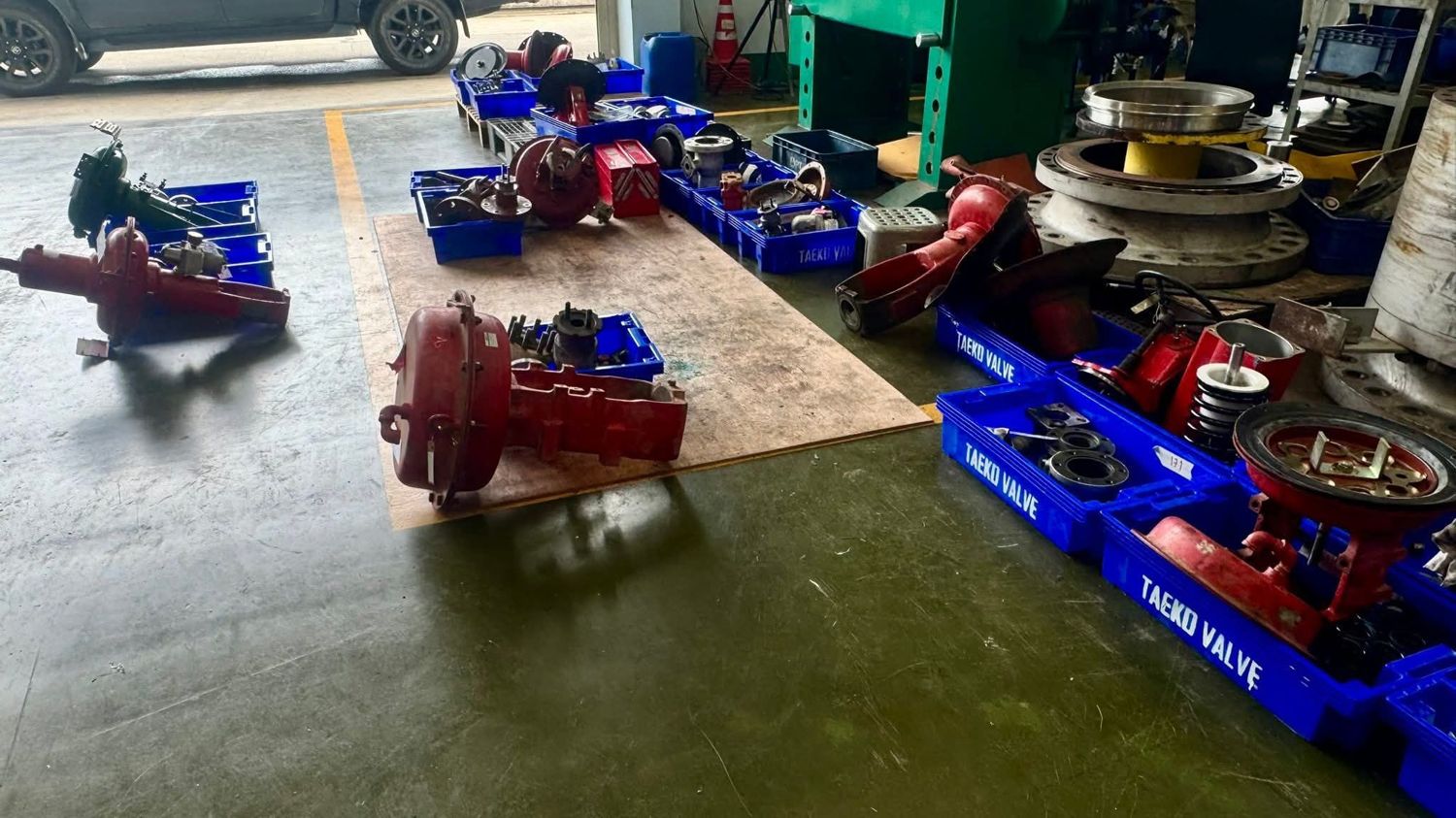 Disassembled control valves in trays
