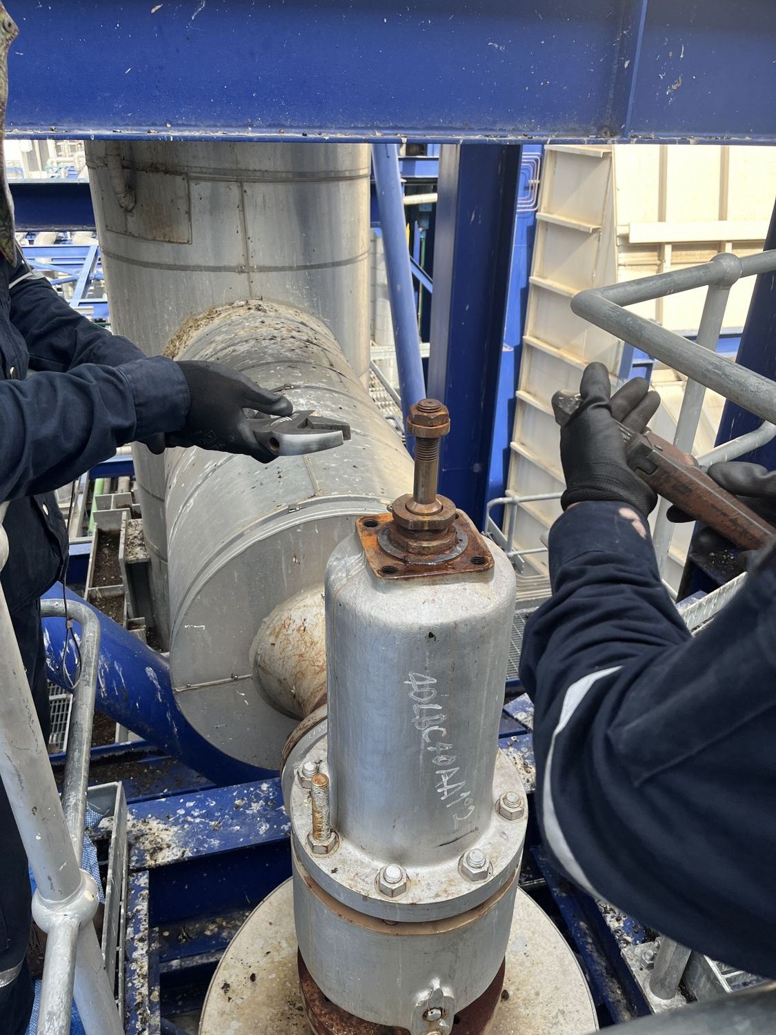 Crew servicing a safety valve on the rack