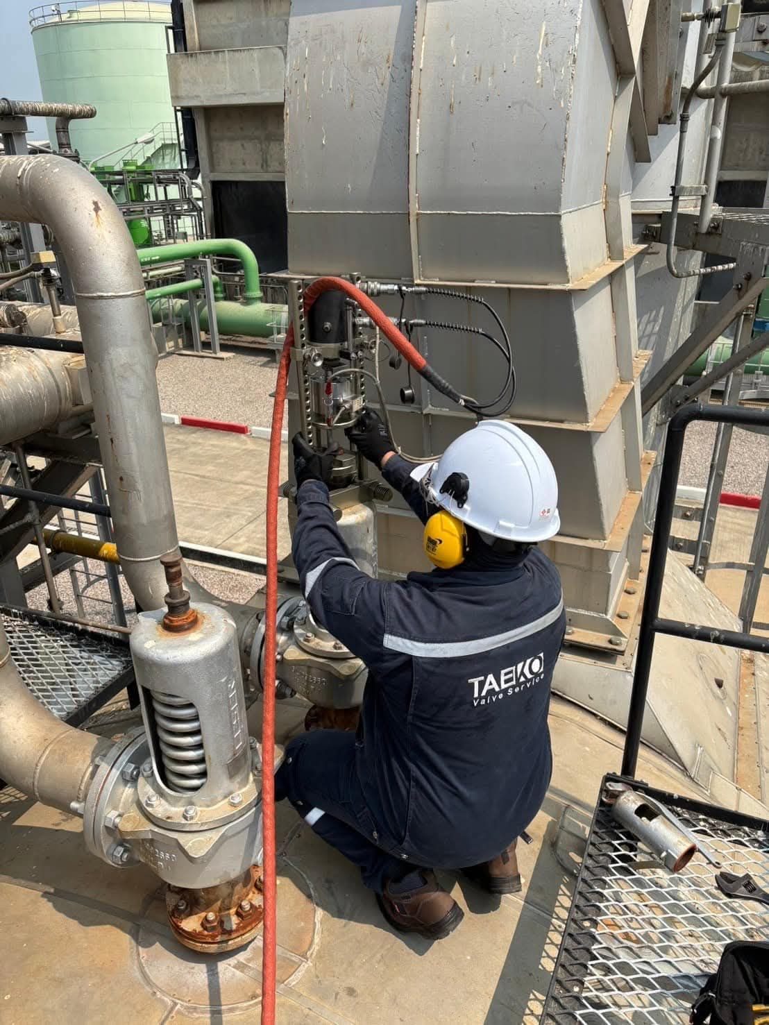 TAEKO engineer servicing a valve